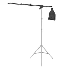 Adjustable photography lighting stand with boom arm and sandbag weight for studio or outdoor use.