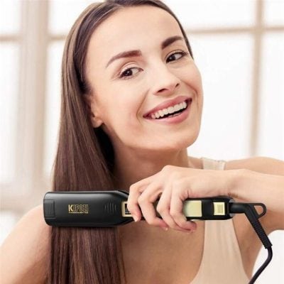 A woman with straight, shiny hair using a flat iron for hair styling. Perfect for hair growth and salon-quality results.