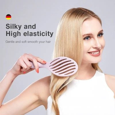 Optimized hair brush for styling and smoothing, offering high elasticity and gentle care for healthy, shiny hair. Perfect for salon or home use.