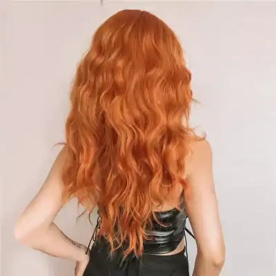 High-resolution image showcasing stunning wavy red hair, perfect for highlighting hair color services at Monalisa Store. Ideal for promoting hair dyeing and styling treatments.