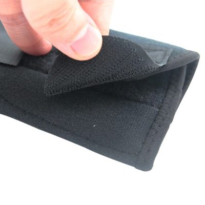 A close-up of a dental orthodontic appliance being applied with adhesive strips for braces or aligners.