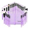 Set of purple and black makeup brushes in a storage pouch, perfect for cosmetics application and beauty routines. Ideal for professional and personal use.