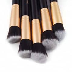 High-quality makeup brushes with black and gold handles, perfect for professional makeup application and skincare routines at Monalisa Store.