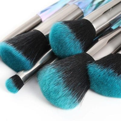 High-quality makeup brushes with blue and black synthetic bristles, ideal for flawless foundation, contouring, and blending. Perfect for professional and personal use at Monalisa Store.