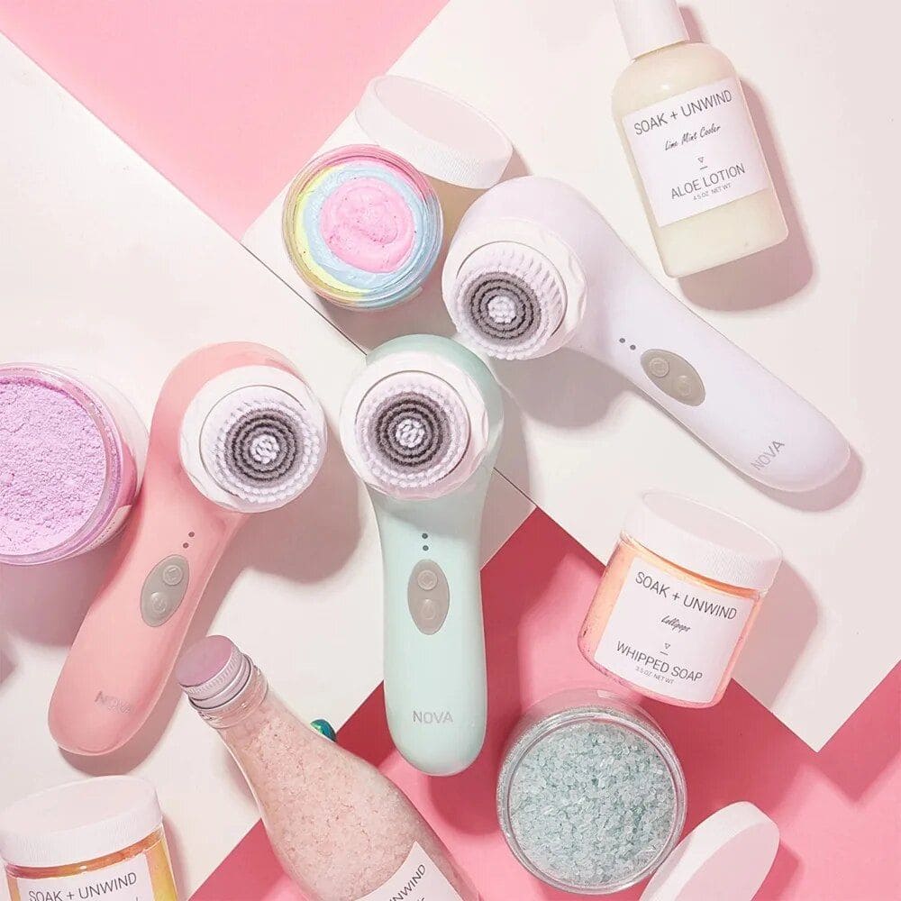 High-quality skincare tools and products displayed, including facial cleansing brushes, aloe lotion, whipped soap, and exfoliating salts, perfect for skincare routines and beauty treatments.