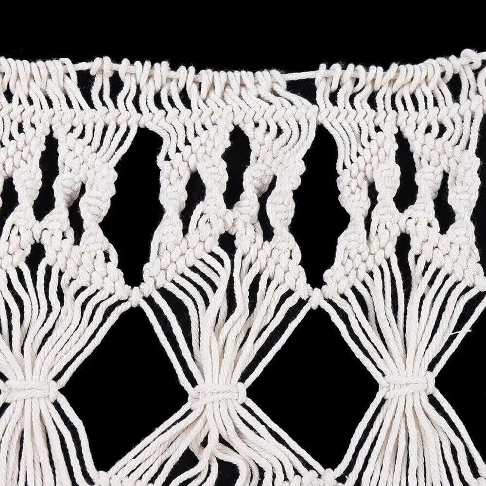Macrame wall decor, handmade boho art, woven textile, home accent, wall tapestry, natural fiber craft, artisanal wall art, decorative weaving.