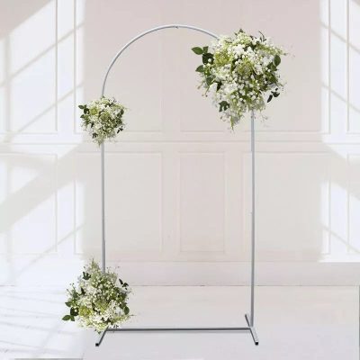 Stylish white wedding arch with floral arrangements, ideal for wedding ceremonies and events, available at Monalisa Store.