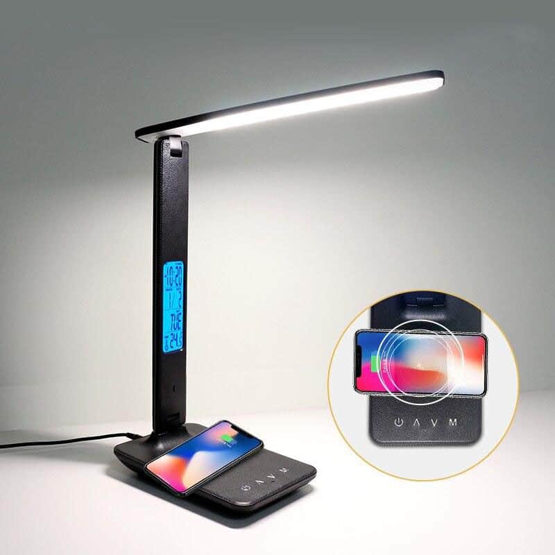 LED desk lamp with digital clock, wireless charging pad, and versatile adjustable light for optimal workspace illumination and convenience.