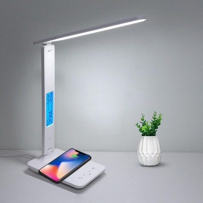 LED desk lamp with adjustable arm, built-in wireless phone charger, digital clock, and temperature display, perfect for modern office and study spaces.