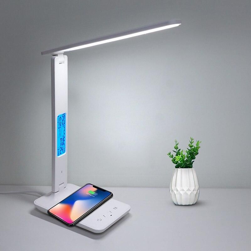 LED desk lamp with adjustable arm, built-in wireless phone charger, digital clock, and temperature display, perfect for modern office and study spaces.