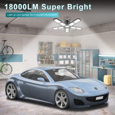 Wide-angle view of a well-lit garage showcasing a sleek blue sports car and organized tools, emphasizing the benefits of Monalisa Store's LED lighting solutions for enhanced visibility and safety.