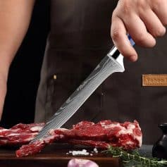 A close-up of a professional chef's knife slicing fresh beef on a wooden cutting board, emphasizing sharpness and precision. Perfect for culinary enthusiasts and professional kitchens.