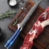 High-quality chef knife ideal for meat slicing and kitchen use, with a Damascus stainless steel blade, ergonomic handle, and sharp edge for precise cuts.