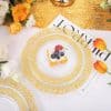 Exquisite gold-rimmed dinnerware with intricate patterns, ideal for elegant dining, celebrations, and upscale events. Perfect for enhancing your table setting with sophistication.