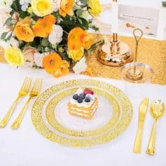 Luxurious table setup featuring gold-handled cutlery, a decorative floral arrangement, and a stylish centerpiece for weddings or special events.