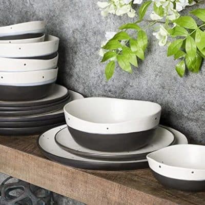 Stylish black and white ceramic bowls and plates for modern table settings, perfect for restaurants, cafes, and home use. Durable and trendy design.