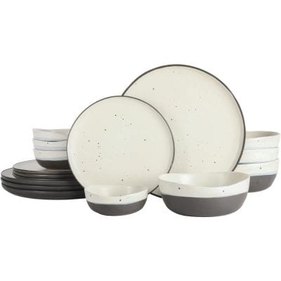 High-quality ceramic dinnerware with a sleek black and white speckled design, suitable for everyday dining or special occasions. These plates and bowls promote a sophisticated table setting, combining durability with contemporary style.