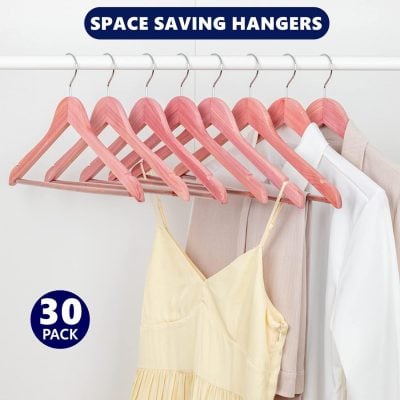 Set of 30, space-efficient pink wooden clothing hangers ideal for organizing closets and maximizing storage space. Perfect for hanging dresses, shirts, and more with sturdy, stylish design.