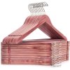 A stack of pink wooden hangers with metal hooks, perfect for organizing glasses or accessories in an optometry or optical store setting.
