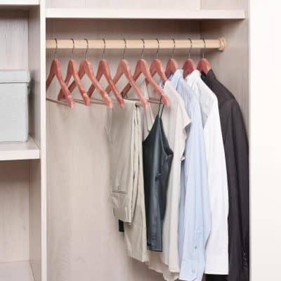 Optical store interior showcasing neatly organized clothing and accessories for eyewear style.