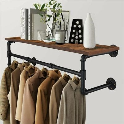 Stylish industrial pipe wall shelf for home decor, perfect for displaying books, plants, or accessories with clothing rack for organized wardrobe storage.