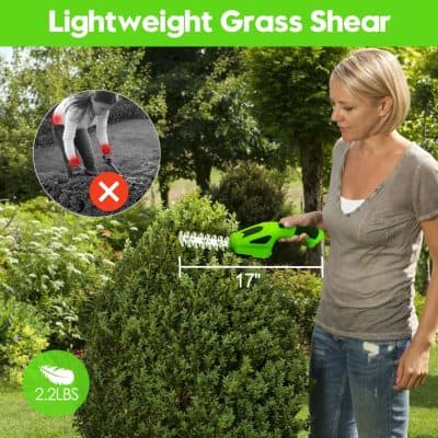 Image of a woman trimming a bush with a 17-inch lightweight grass shear, ideal for gardening, landscaping, and hedge trimming, weighing 2.2 lbs for easy use.