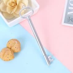 Sleek, silver key-shaped optical tool suitable for adjusting and maintaining eyeglasses and sunglasses, ideal for opticians and eyewear enthusiasts.