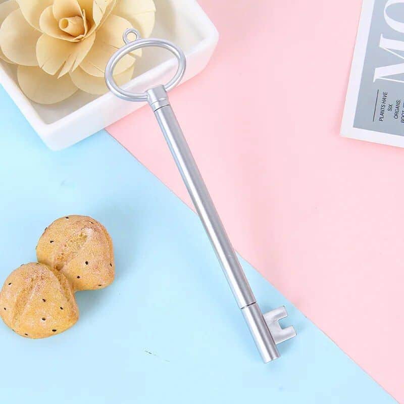 Sleek, silver key-shaped optical tool suitable for adjusting and maintaining eyeglasses and sunglasses, ideal for opticians and eyewear enthusiasts.