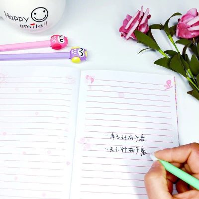 Bright smiley face stationery set with adorable pink and purple pens, floral accents, and lined notebooks, making it a delightful addition to any desk, especially for fans of cute, cheerful office supplies indoors or at school.