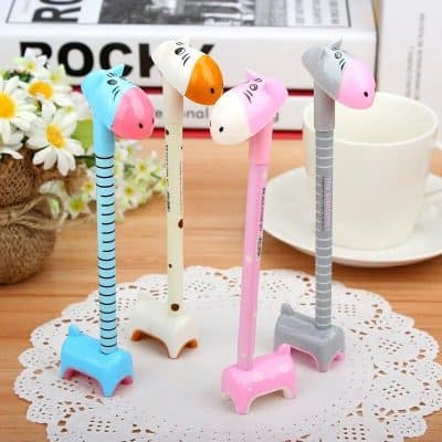 Adorable giraffe-shaped pens in pastel colors, perfect for kids or cute stationery collections. Features striped and dotted designs with sturdy bases for easy writing.