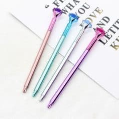 Adorable pastel heart-top pens in pink, blue, purple, and silver, ideal for gift shops or stationery stores. Perfect for writing, journaling, or decorating your desk with colorful accessories.
