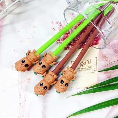 Cute lion-themed pen set for stationery lovers, featuring adorable lion head toppers in bright green and brown colors, perfect for office or school use.