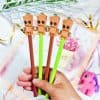 Adorable Baby Groot design pens featuring cartoon character toppers, perfect for kids and fans. Bright colors and playful style ideal for stationery lovers and gift items.