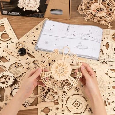 Wooden clock kit for customizable home decor and crafts, includes gears, clock face, and assembly tools for handcrafted timepieces.