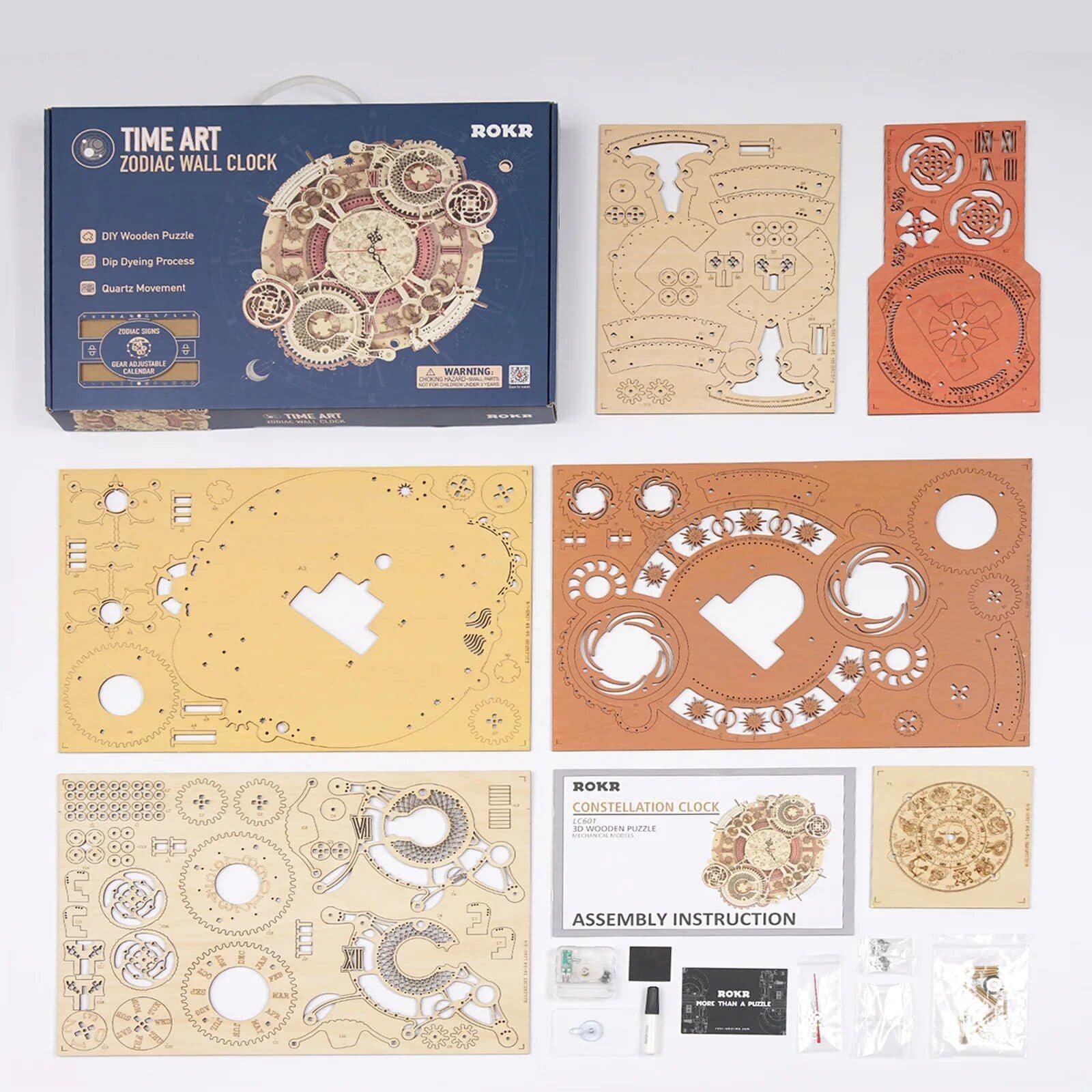Detailed photo of the DIY Zodiac Wall Clock kit with wooden and metal parts for assembling a decorative clock, includes instruction manual, tools, and all assembly components for horology enthusiasts.