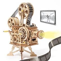 Optical film camera for cinema and filmmaking, with reels, lens, and film strip detail, suitable for movie production, cinematography, and vintage film equipment images.