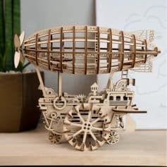 Detailed wooden airship model for display and decoration. Crafted with precision, ideal for collectors and aviation enthusiasts. Perfect for home or office decor.