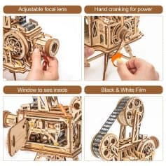2. Close-up of wooden mechanical model showing adjustable focal lens, hand crank, interior window, and black & white film roll for intricate craftsmanship and DIY mechanical projects.