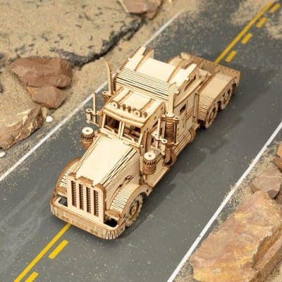 Wooden truck model, detailed craftsmanship, perfect for decorative displays or educational projects related to vehicles and transportation.