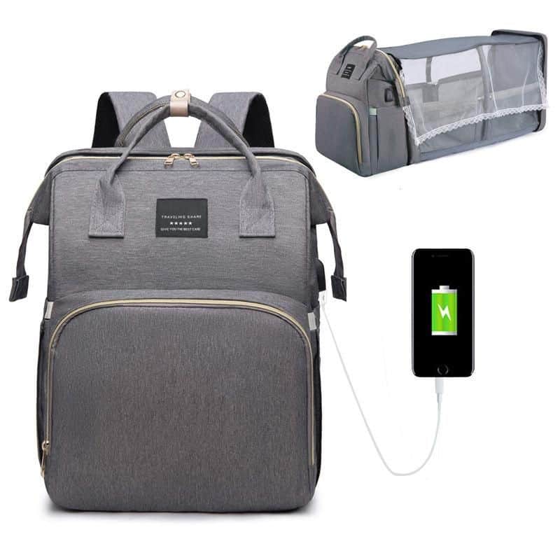 Stylish gray travel backpack with USB charging port, spacious compartments, and ergonomic design for versatile trips and daily use. Perfect for work, travel, or school.