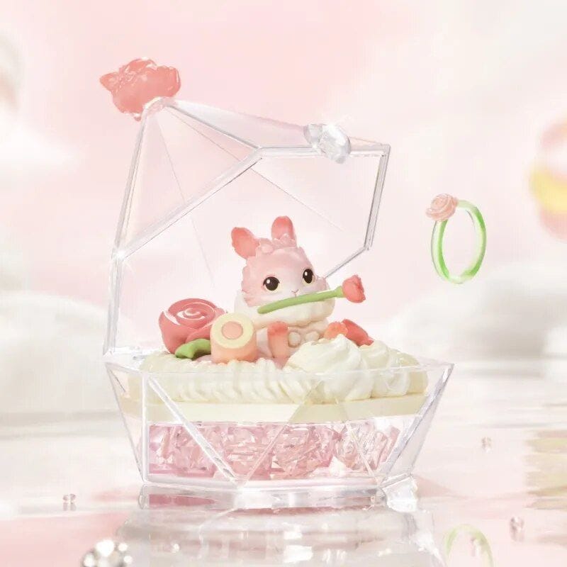 Cute bunny-themed jewelry storage featuring a pink bunny figurine, rings, and accessories in a transparent container, perfect for organizing jewelry with a charming and whimsical look.