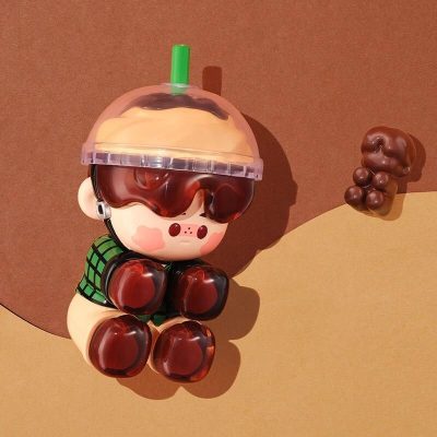 Charming monkey figurine with coffee cup hat, featuring chocolate accents, ideal for optometry shops and optical store displays. Bright and playful design enhances visual appeal.