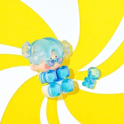Bright girl doll with heart sunglasses, pastel blue hair, and playful accessories for kids' fashion and toys.