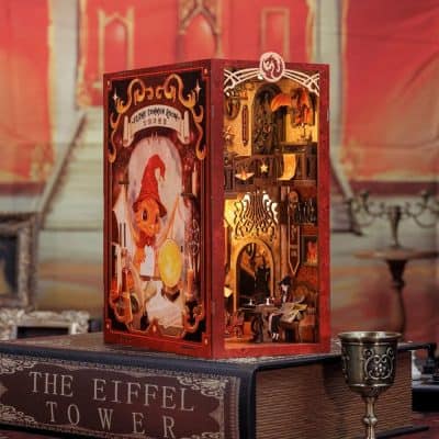 Detailed Halloween-themed candle holder with intricate design, featuring a witch and magical elements, ideal for festive home decor or themed events focused on enchanted nights.