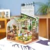 Detailed miniature garden with vibrant plants, tiny furniture, and charming accessories suitable for home decor and DIY craft projects. Perfect for creating a unique, stylish indoor or outdoor space.
