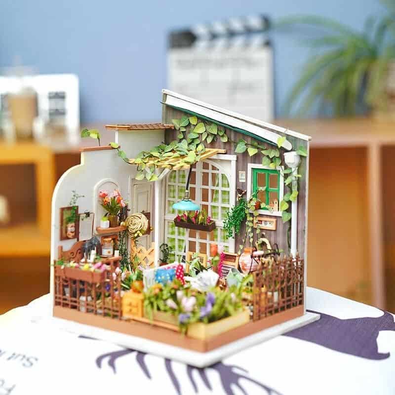 Detailed miniature garden with vibrant plants, tiny furniture, and charming accessories suitable for home decor and DIY craft projects. Perfect for creating a unique, stylish indoor or outdoor space.