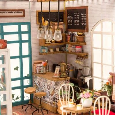 A charming coffee shop with a rustic decor featuring a wooden counter, colorful tiles, and cozy seating areas. Ideal for relaxing or working, with a warm ambiance perfect for coffee lovers.