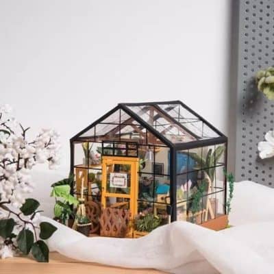 Detailed small greenhouse showcasing eyewear and accessory displays for optical stores and opticians.