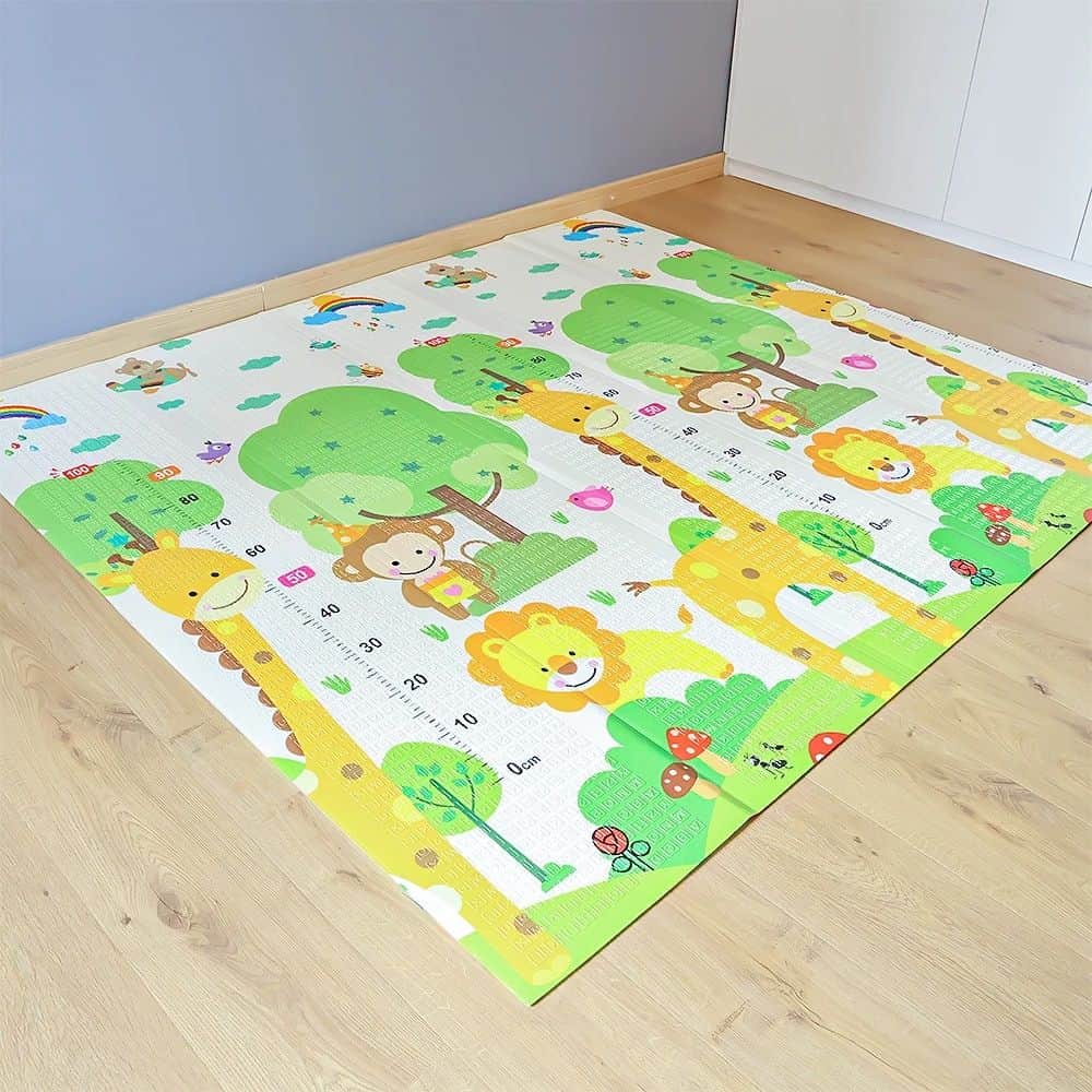 Colorful children's playroom rug featuring elephants, lions, giraffes, trees, and playful animals; perfect for kids' bedrooms or play areas, adding vibrant, educational decor.