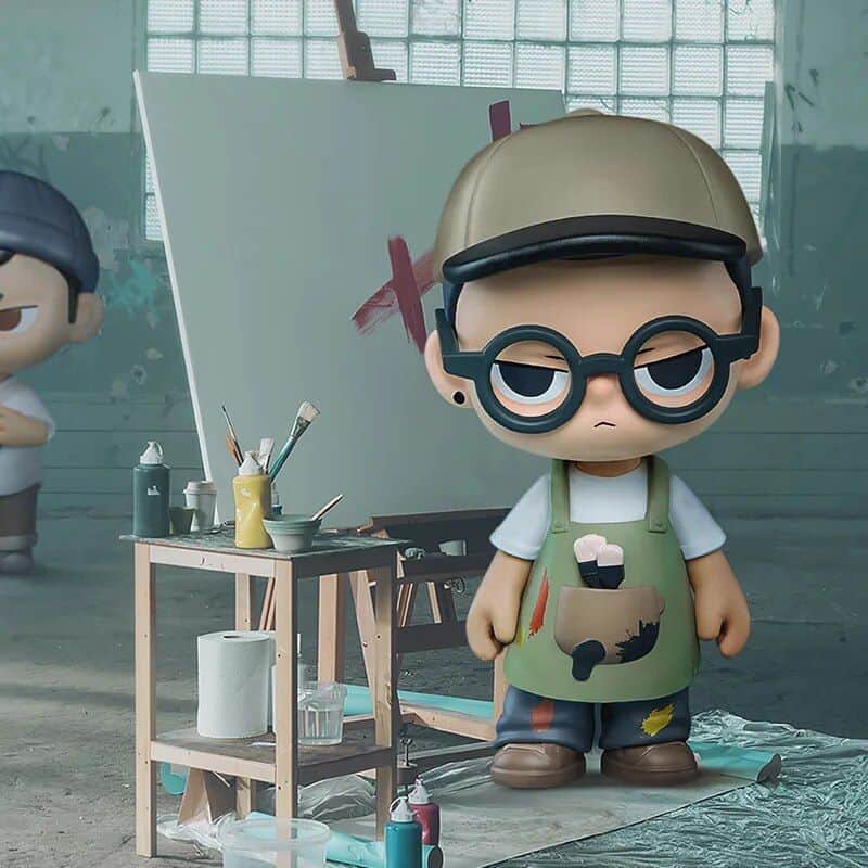 Brightly colored artistic sculpture of a child artist character with glasses, apron, and painting supplies in an art studio setting. Perfect for children's art and craft-themed decor or promotional images for art stores.